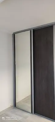 a sliding glass door with a reflection in a room at Cannes carnot in Cannes