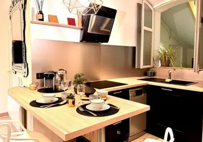 a kitchen with a table with two dishes on it at StudioCalifornia-Parking-Plages 15 min walk in Cannes