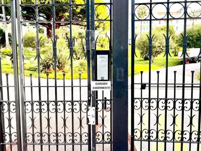 a black gate with a sign in front of it at StudioCalifornia-Parking-Plages 15 min walk in Cannes