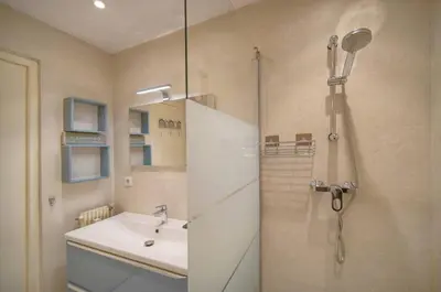 a bathroom with a shower and a sink at MIPIM HORIZONS Executive Sea View Apartment 2 Bedrooms Terrace Pool Parking in Cannes