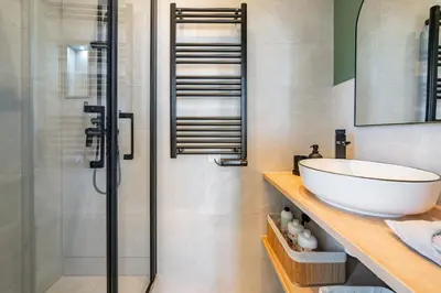 a bathroom with a sink and a shower at The Palm - 5mn Palais - Croisette - Beaches in Cannes