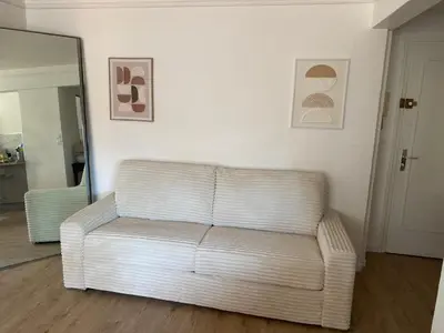 a kitchen counter with two vases with flowers on it at Appartement 45m2 - 4 couchages - Proche Cannes -plages à 2km -wifi rapide in Le Cannet