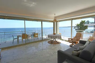 a living room with a view of the ocean at AMAZING SEA VIEW APARTMENT in Cannes