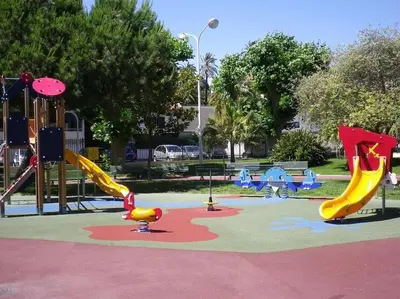 a playground with slides and slidesktop at 2 pièces avec piscine, 150 m de la plage. in Cannes
