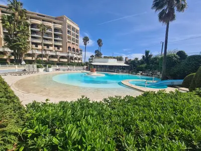 a large swimming pool in front of a building at BOCCA CABANA in Cannes