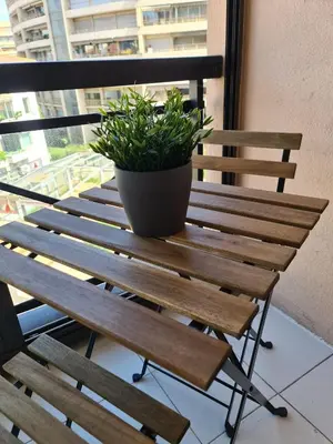 a potted plant sitting on top of a wooden bench at BOCCA CABANA in Cannes