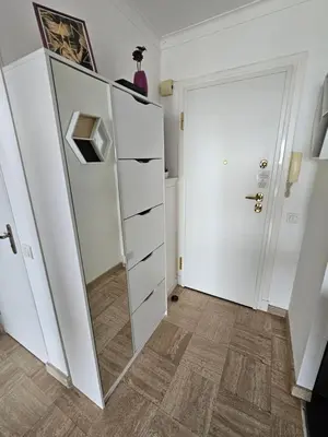 a dressing room with a mirror and a closet at Superbe vue mer à 50 mètres des plages in Cannes