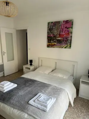 a bedroom with a bed with two towels on it at Appartement Cannes in Cannes