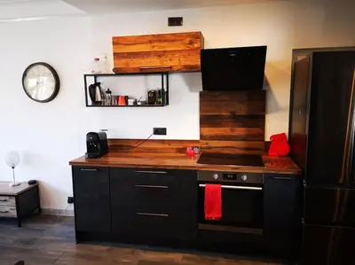 a kitchen with a stove top oven next to a refrigerator at Cannes Cosy Oasis in Cannes