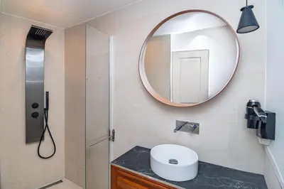 a bathroom with a sink and a mirror at Merveilleux appartement - Proche de la Croisette ! in Cannes