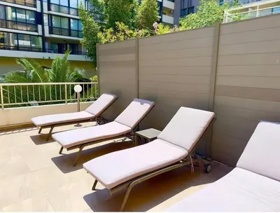 a row of lounge chairs sitting on a patio at Sweet home+terrasse de 60m2 ,2 mn from croisette beach in Cannes