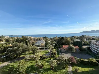 a view from a window of a golf course at Appartement vue mer proches plages et congrès in Cannes