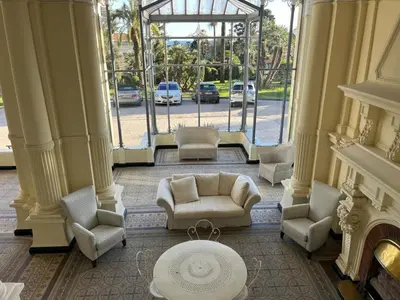 a living room with a couch and chairs and a fireplace at Appartement vue mer proches plages et congrès in Cannes
