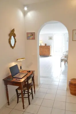 a kitchen with a table and chairs in a room at Appartement vue mer proches plages et congrès in Cannes