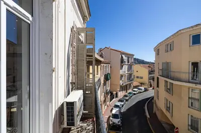 a view of a city street from a window at 34 BORNIOL - Bel appartement rénové avec mezzanine Cannes in Cannes