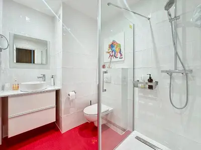 a bathroom with a shower and a toilet and a sink at Rooftop Grande terrasse Vue mer in Cannes