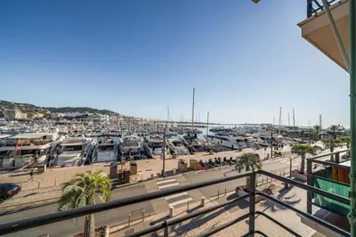 a marina with a lot of parked boats at Cozystay 1669 Old Port View Elegant 3-Bedroom Apartment in Cannes