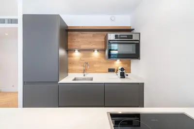 a kitchen with a sink and a microwave at Magnificent 2 bedroom in the heart of Cannes in Cannes