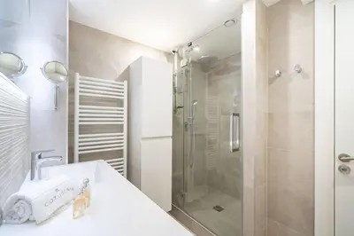 a bathroom with a shower and a sink at Magnificent 2 bedroom in the heart of Cannes in Cannes