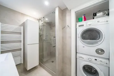 a laundry room with a washer and dryer at Magnificent 2 bedroom in the heart of Cannes in Cannes