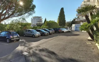 a row of cars parked in a parking lot at Villa Luna Nova in Cannes