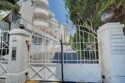 a gate in front of a building with a building at Villa Luna Nova in Cannes