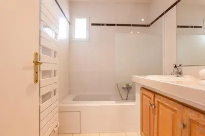 a bathroom with a tub and a sink at RARE! 120m ROOFTOP 5-minute walk to downtown in Cannes