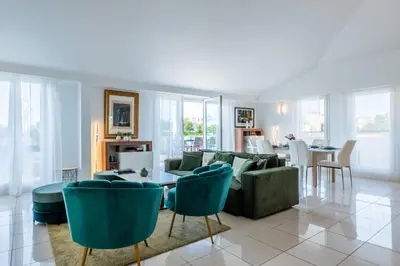 a living room with a couch and chairs and a table at RARE! 120m ROOFTOP 5-minute walk to downtown in Cannes