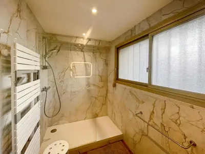 a bathroom with a shower and a sink at Deluxe 2 bedroom apartment in Cannes