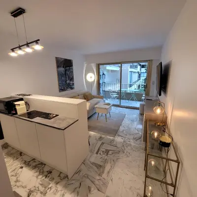 a living room with a couch and a table at Bell Appartement Cannes in Cannes