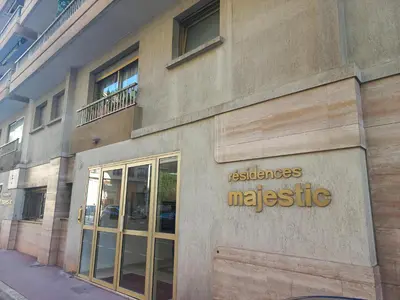 a building with a sign on the side of it at Bell Appartement Cannes in Cannes