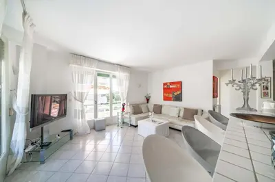 a living room with a couch and a tv at Pleasant 2 bedroom close to the center of Cannes in Cannes