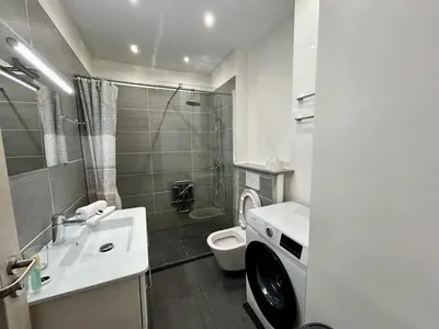 a bathroom with a white sink and a toilet at C029-Appartement spacieux a deux pas de la Croisette in Cannes
