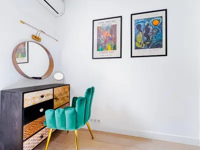 a room with a mirror and a chair and a dresser at Le canopée - Cozy Suquet Cannes Centre in Cannes