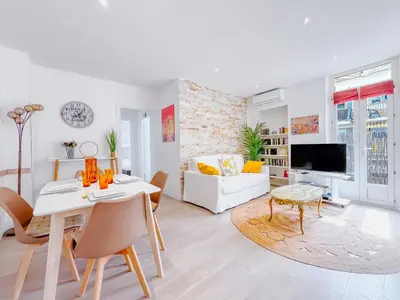 a white living room with a white table and chairs at Le canopée - Cozy Suquet Cannes Centre in Cannes