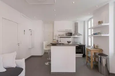 a kitchen with white walls and a white counter top at 