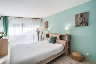 a bedroom with a large bed and a window at Nice one bedroom in the heart of Cannes in Cannes