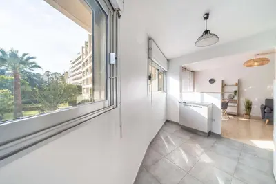 an empty hallway with a large window and a view at Nice one bedroom in the heart of Cannes in Cannes