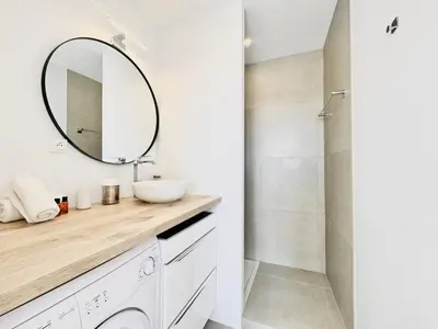 a bathroom with a sink and a mirror at L'impérator - Petit Juas Cannes in Cannes