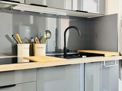 a kitchen with a sink and a counter top at L'impérator - Petit Juas Cannes in Cannes