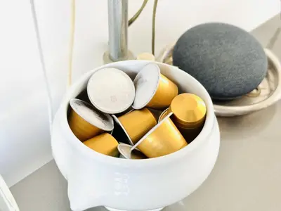 a white container filled with utensils on a counter at L'impérator - Petit Juas Cannes in Cannes