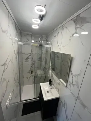 a bathroom with a shower and a sink at Appartement 3 pièces GREEN ART **** in Le Cannet