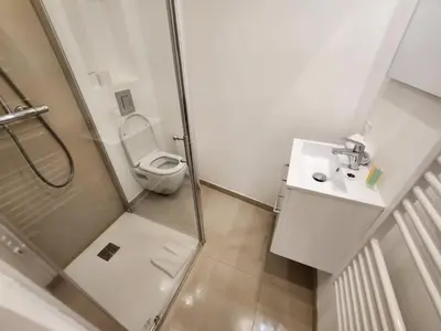 a bathroom with a shower and a toilet and a sink at C073-Studio neuf et lumineux au carre d'or Croisette in Cannes