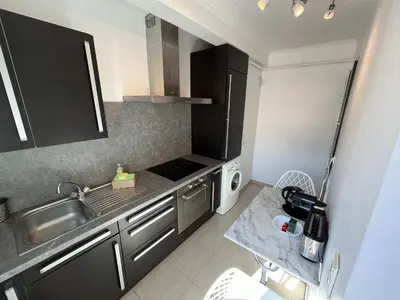 a small kitchen with a sink and a stove at C067-Beau Studio a 100 m des plages et proche Palais in Cannes