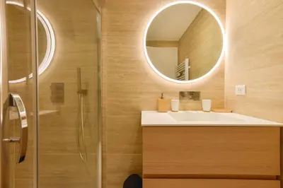 a bathroom with a sink and a mirror at Upscale 1-Br apartment 100 meter from the Palais des Festivals in Cannes