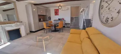 a living room with a couch and a table at M.M.R. Gioma in Cannes