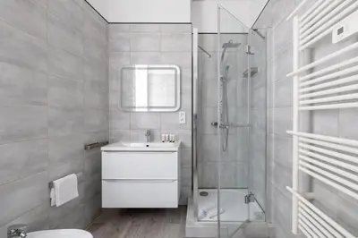a bathroom with a shower and a sink and a toilet at Beau 3 pièces à 500m du Palais des Festival in Cannes