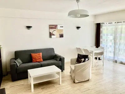 a living room with a couch and a table at Grand 2 pieces- Marche Forville in Cannes
