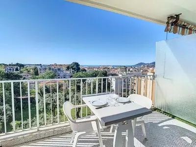 a white table and chairs on a balcony with a view at Le Montfleury - Studio 28m2 - Vue mer - Centre in Cannes