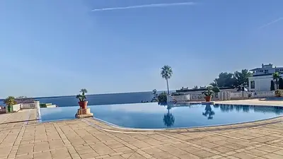 a swimming pool with a view of the water at Le Francia - T2 30m2 - Piscine - Vue mer in Cannes